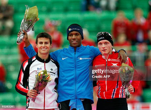 First-placed Shane Davis of the US is flanked by second-placed Lucas Makowsky of Canada and third-placed Haavard Boekko of Norway after the men's...