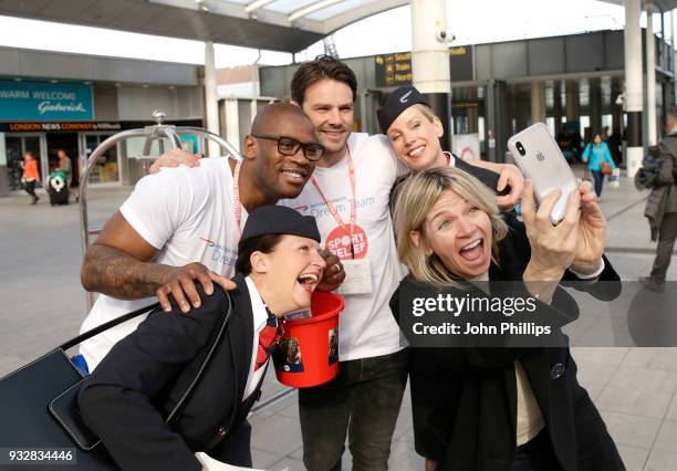 Ugo Monye and Ben Foden pose with British Airways staff, and unexpected customer Zoe Ball at Gatwick Airport whilst raising money for Sport Relief on...