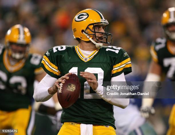 Aaron Rodgers of the Green Bay Packers looks for a receiver against the Dallas Cowboys at Lambeau Field on November 15, 2009 in Green Bay, Wisconsin....