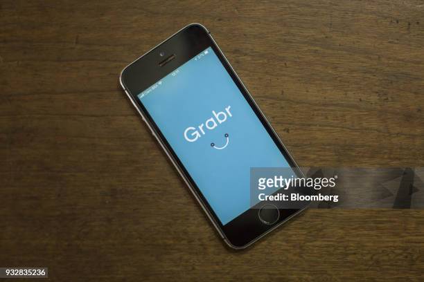 The Grabr Inc. Application is displayed on an Apple Inc. IPhone in an arranged photograph taken in Sao Paulo, Brazil, on Wednesday, March 14, 2018....