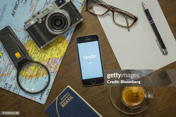 The Grabr Inc. Application is displayed on an Apple Inc. IPhone in an arranged photograph taken in Sao Paulo, Brazil, on Wednesday, March 14, 2018....