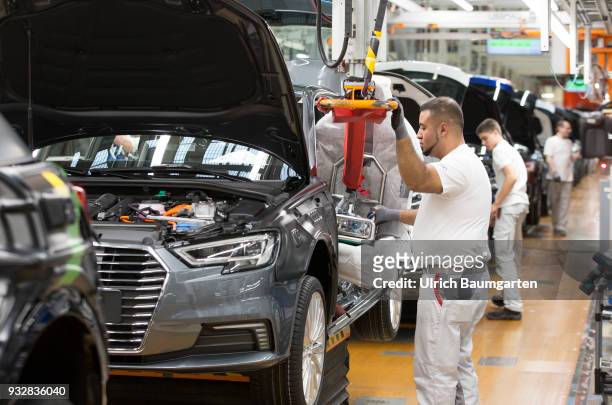 Car production at Audi AG in Ingolstadt. Installation of the front seats on the Audi A3/Q2,