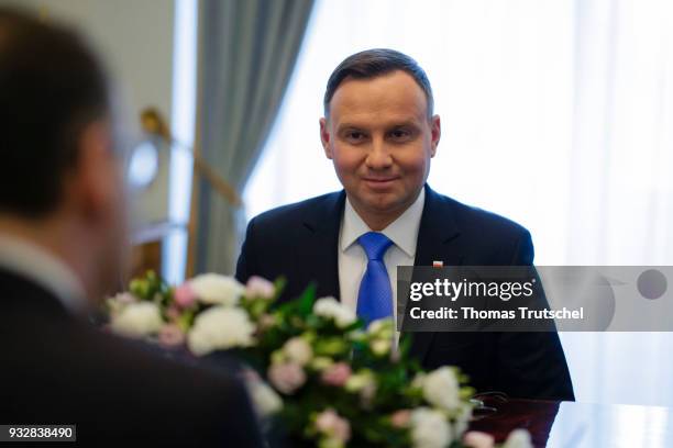 Presdient of the Republic of Poland Andrzej Duda chats with German Foreign Minister and Vice Chancellor Heiko Maas on October 16, 2018 in Warsaw,...