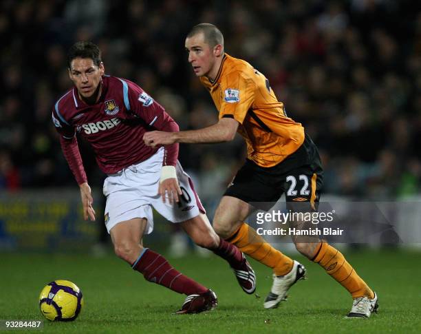 Guillermo Franco of West Ham contests with Dean Marney of Hull during the Barclays Premier League match between Hull City and West Ham United at the...