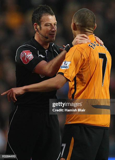 Referee Mark Clattenburg speaks with Chris Fagan of Hull during the Barclays Premier League match between Hull City and West Ham United at the KC...