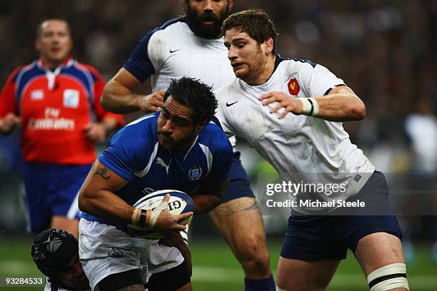 Henry Faafili of Samoa shields the ball from Pascal Pape of France during the International Rugby Union match between France and Samoa at the Stade...