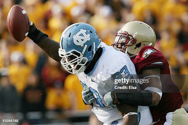 Cam Thomas of the North Carolina Tar Heels celebrates as Montel Harris of the Boston College Eagles tries to make the tackle on November 21, 2009 at...