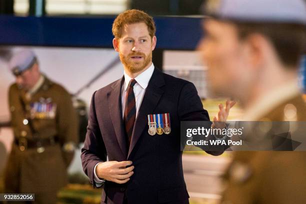 Prince Harry attends a ceremony at the Museum of Army Flying as he presents 12 pilots from Course 17/02 of the Army Air Corps with their Wings on...