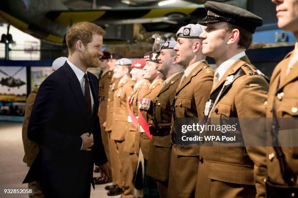 Prince Harry attends a ceremony at the Museum of Army Flying as he presents 12 pilots from Course 17/02 of the Army Air Corps with their Wings on...