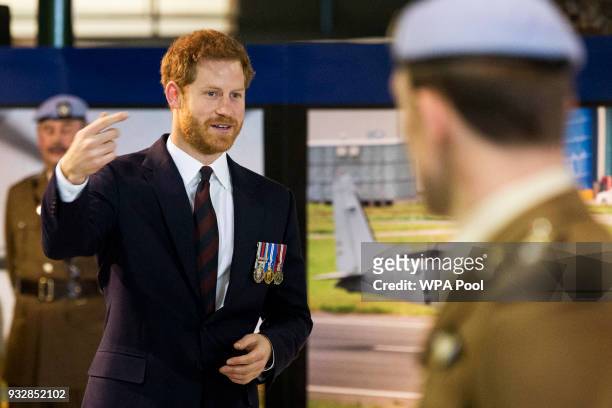 Prince Harry attends a ceremony at the Museum of Army Flying as he presents 12 pilots from Course 17/02 of the Army Air Corps with their Wings on...