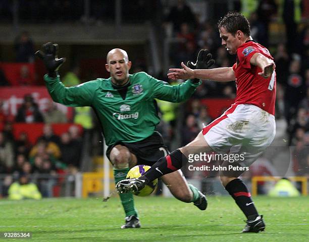 Michael Owen of Manchester United clashes with Tim Howard of Everton during the FA Barclays Premier League match between Manchester United and...