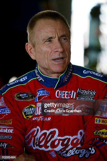 Mark Martin, driver of the Kellogg's/CARQUEST Chevrolet, stands in the garage prior to practice for the NASCAR Sprint Cup Series Ford 400 at...