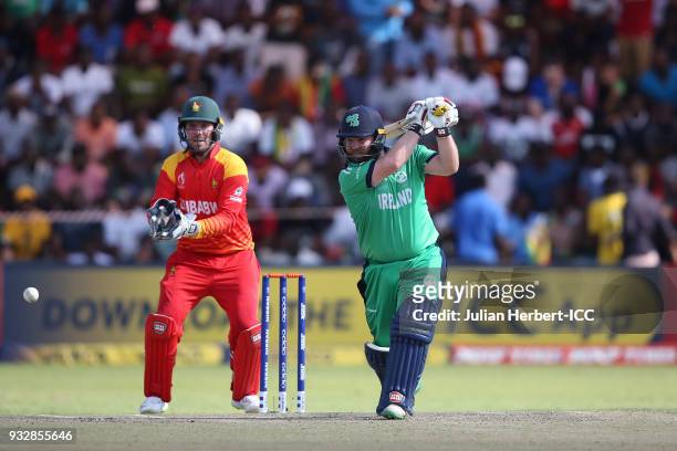 Brenddan Taylor of Zimbabwe looks on as Paul Stirling Of Ireland scores runs during The ICC Cricket World Cup Qualifier between Ireland and Zimbabwe...