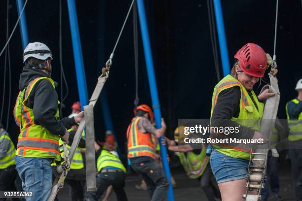 Workers are seen erecting the main Cirque Du Soleil tent for their latest show 'Totem' on March 16, 2018 in Barcelona, Spain. The main tent has a...