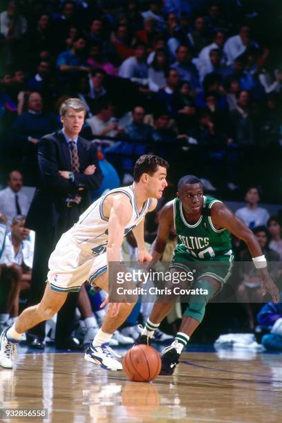 Tony Bennett of the Charlotte Hornets dribbles on March 14, 1994 at the Charlotte Coliseum in Charlotte, North Carolina. NOTE TO USER: User expressly...