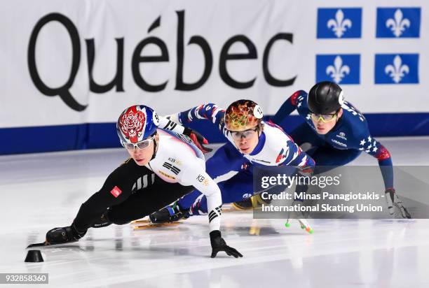 Dae Heon Hwang of Korea competes against Semen Elistratov of Russia and John-Henry Krueger of the USA during the World Short Track Speed Skating...