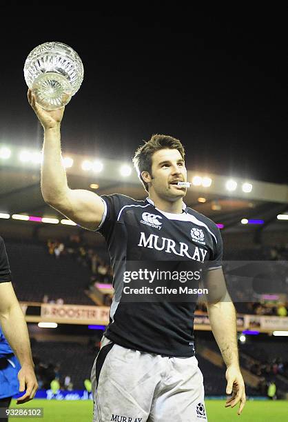 Johnnie Beattie of Scotland lifts the trophy after victory in the Bank Of Scotland Corporate Autumn Tests match between Scotland and Australia at...