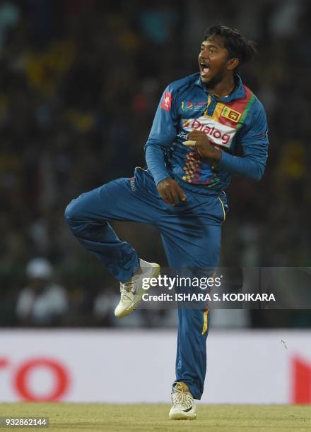 Sri Lankan cricketer Akila Dananjaya celebrates the dismissal of Bangladesh cricketer Liton Das during the sixth Twenty20 international cricket match...