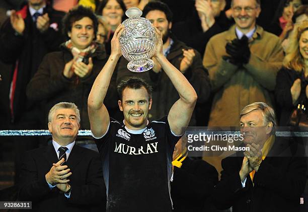 Al Killock of Scotland lifts the trophy after victory in the Bank Of Scotland Corporate Autumn Tests match between Scotland and Australia at...