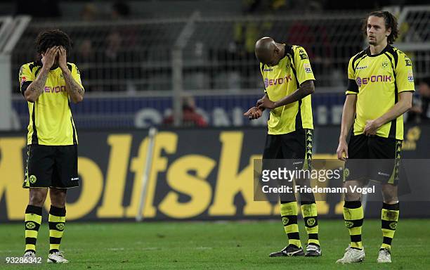 Patrick Owomoyela, Santana and Neven Subotic looks dejected after the Bundesliga match between Borussia Dortmund and FSV Mainz 05 at Signal Iduna...