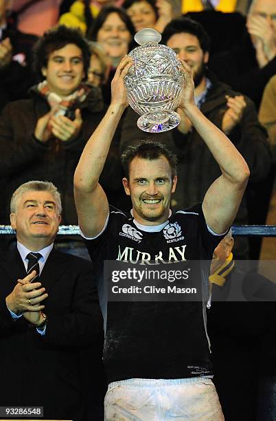 Al Killock of Scotland lifts the trophy after victory in the Bank Of Scotland Corporate Autumn Tests match between Scotland and Australia at...