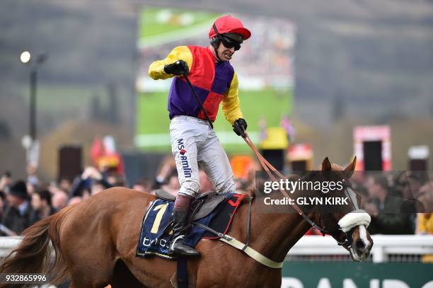 Jockey Richard Johnson celebrates with Native River after winning the Gold Cup race on the final day of the Cheltenham Festival horse racing meeting...