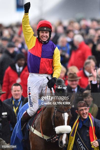 Jockey Richard Johnson celebrates with Native River after winning the Gold Cup race on the final day of the Cheltenham Festival horse racing meeting...