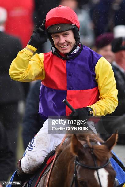 Jockey Richard Johnson celebrates with Native River after winning the Gold Cup race on the final day of the Cheltenham Festival horse racing meeting...