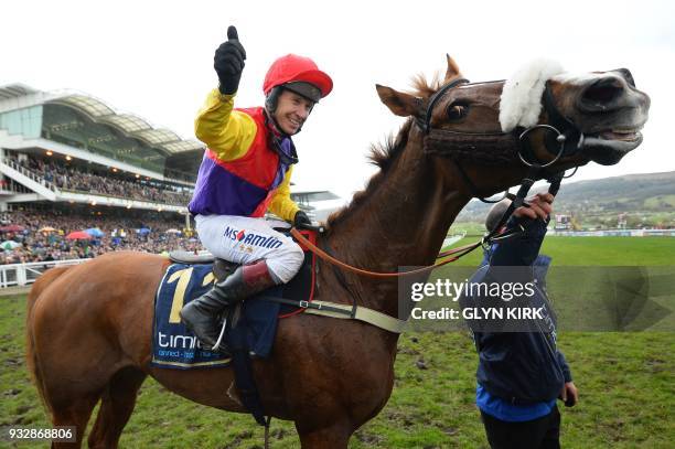 Jockey Richard Johnson celebrates with Native River after winning the Gold Cup race on the final day of the Cheltenham Festival horse racing meeting...