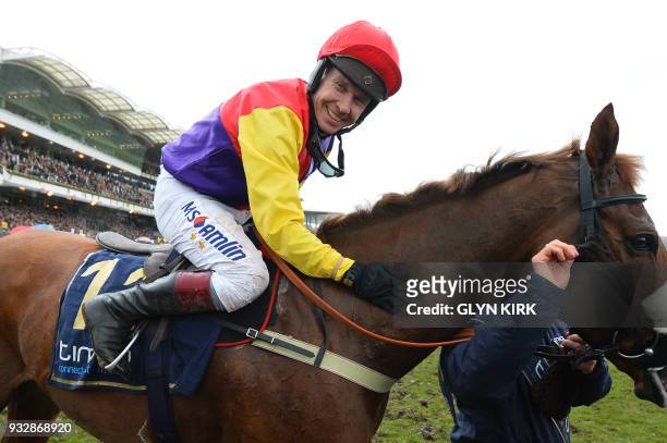 Jockey Richard Johnson celebrates with Native River after winning the Gold Cup race on the final day of the Cheltenham Festival horse racing meeting...