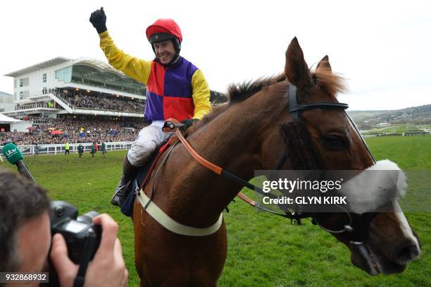 Jockey Richard Johnson celebrates with Native River after winning the Gold Cup race on the final day of the Cheltenham Festival horse racing meeting...