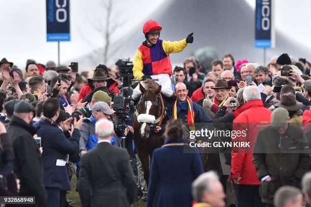 Jockey Richard Johnson celebrates with Native River after winning the Gold Cup race on the final day of the Cheltenham Festival horse racing meeting...