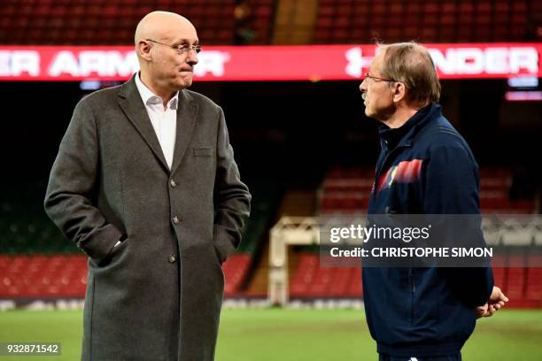 French rugby team coach Jacques Brunel chats with Bernard Laporte, French president of the rugby federationan, before the captain run at the...