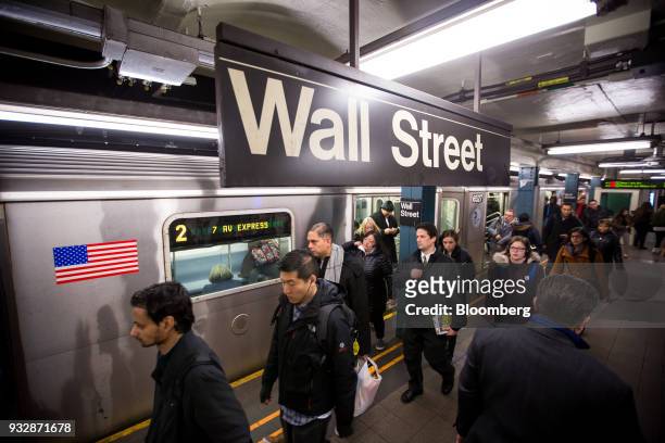 Commuters exit a train at a Wall Street subway station near the New York Stock Exchange in New York, U.S., on Friday, March 16, 2018. U.S. Stocks...