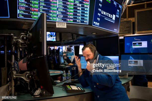 Trader works on the floor of the New York Stock Exchange in New York, U.S., on Friday, March 16, 2018. U.S. Stocks broke out of their four-day slump...