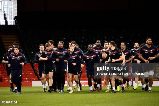 French rugby players take part in the captain run at the Millenium stadium, in Cardiff on March 16 on the eve of their game against wales. / AFP...