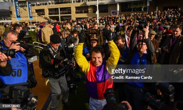 Cheltenham , United Kingdom - 16 March 2018; Jockey Richard Johnson celebrates with the Gold Cup after winning the Timico Cheltenham Gold Cup Steeple...