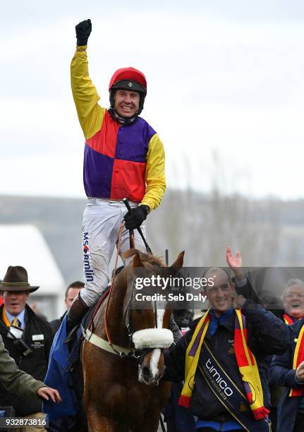 Cheltenham , United Kingdom - 16 March 2018; Jockey Richard Johnson celebrates as he enters the winners' enclosure after winning the Timico...