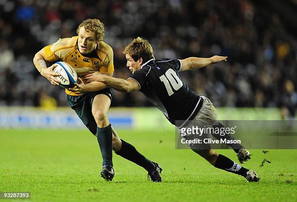 Ryan Cross of Australia is tackled by Phil Godman of Scotland during the Bank Of Scotland Corporate Autumn Tests match between Scotland and Australia...
