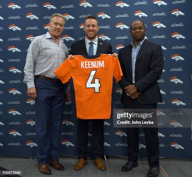 John Elway, general manager and executive vice president of football operations of the Denver Broncos and head coach Vance Joseph present quarterback...