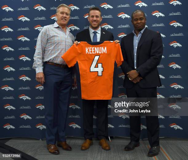 John Elway, general manager and executive vice president of football operations of the Denver Broncos and head coach Vance Joseph present quarterback...