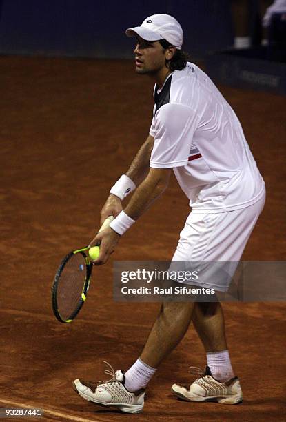 Eduardo Schwank of Argentina serves to Brian Dabul of Argentina during the Lima Challenger Movistar Open on November 21, 2009 in Lima, Peru.