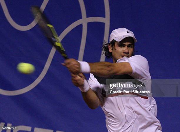 Eduardo Schwank of Argentina returns a shot against Brian Dabul of Argentina during the Lima Challenger Movistar Open on November 21, 2009 in Lima,...