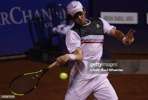 Eduardo Schwank of Argentina returns a shot against Brian Dabul of Argentina during the Lima Challenger Movistar Open on November 21, 2009 in Lima,...