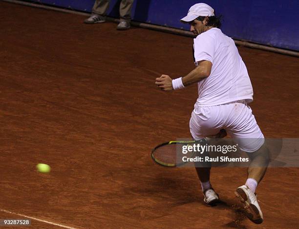 Eduardo Schwank of Argentina returns a shot against Brian Dabul of Argentina during the Lima Challenger Movistar Open on November 21, 2009 in Lima,...