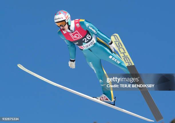 Gregor Deschwanden from Switzerland soars through the air during the men's ski jumping event of the FIS World Cup qualification round in Vikersund,...