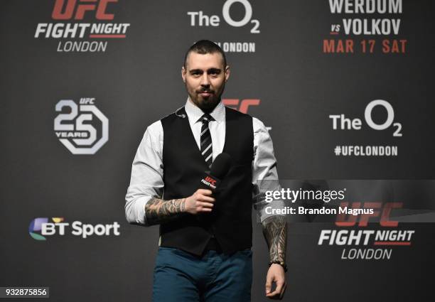 Commentator Dan Hardy interacts with fans during a Q&A session before the UFC Fight Night weigh-in inside The O2 Arena on March 16, 2018 in London,...