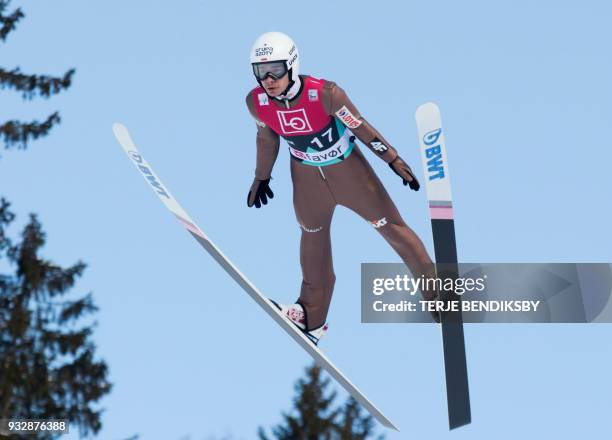 Jakub Wolny from Poland soars through the air during the men's ski jumping event of the FIS World Cup qualification round in Vikersund, Norway, on...
