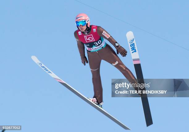 Dawid Kubacki from Poland soars through the air during the men's ski jumping event of the FIS World Cup qualification round in Vikersund, Norway, on...