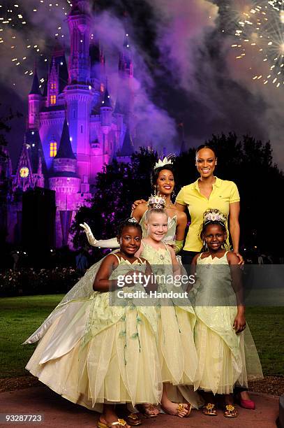 In this handout image provided by Disney, Emmy Award-winning talk show host and supermodel Tyra Banks poses with Disney's newest princess, Tiana ,...